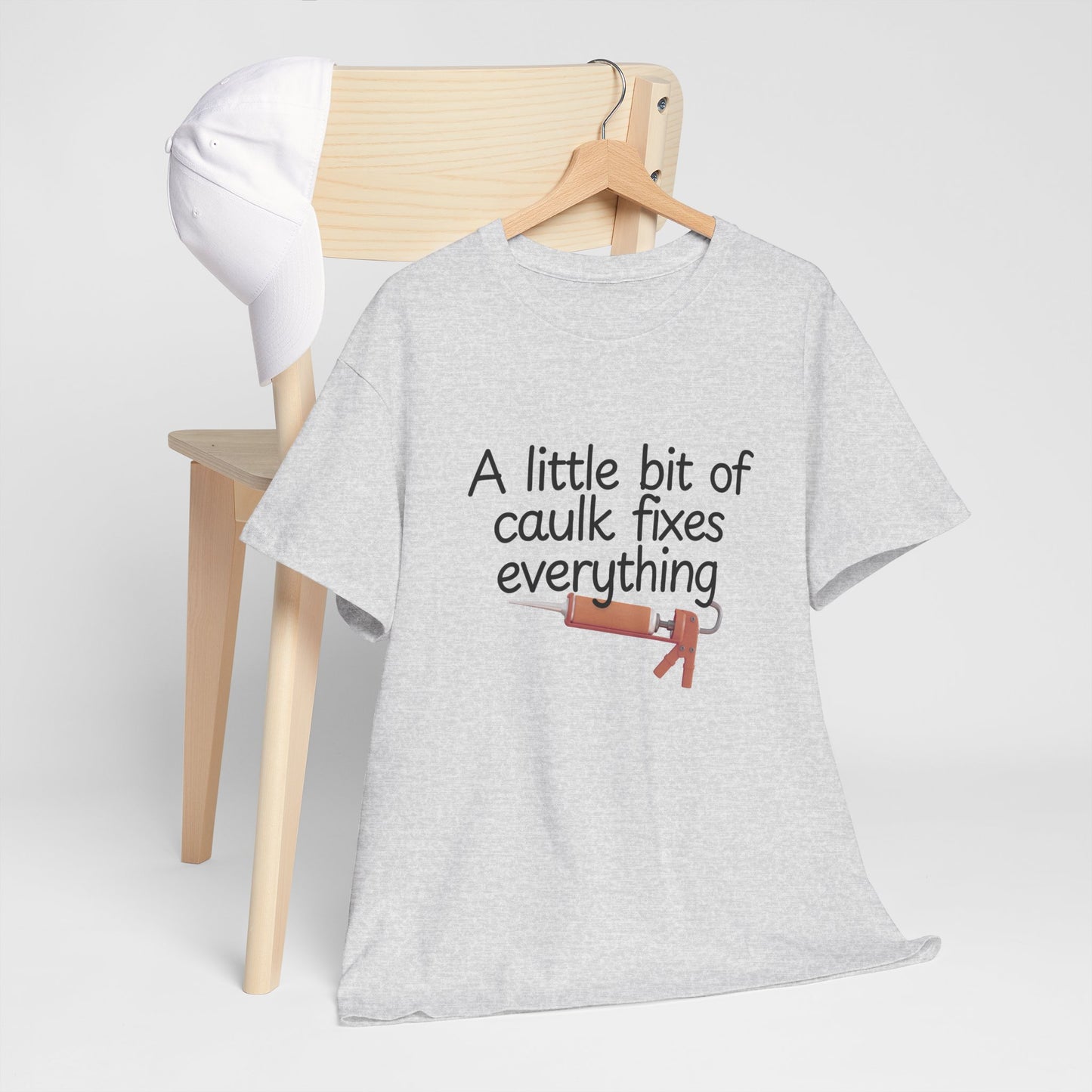 Men's Graphic Tee - Funny Shirt with 'A Little Bit of Caulk Fixes Everything'