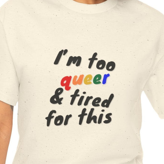 Woman wearing a cream t-shirt with colorful text on a white background