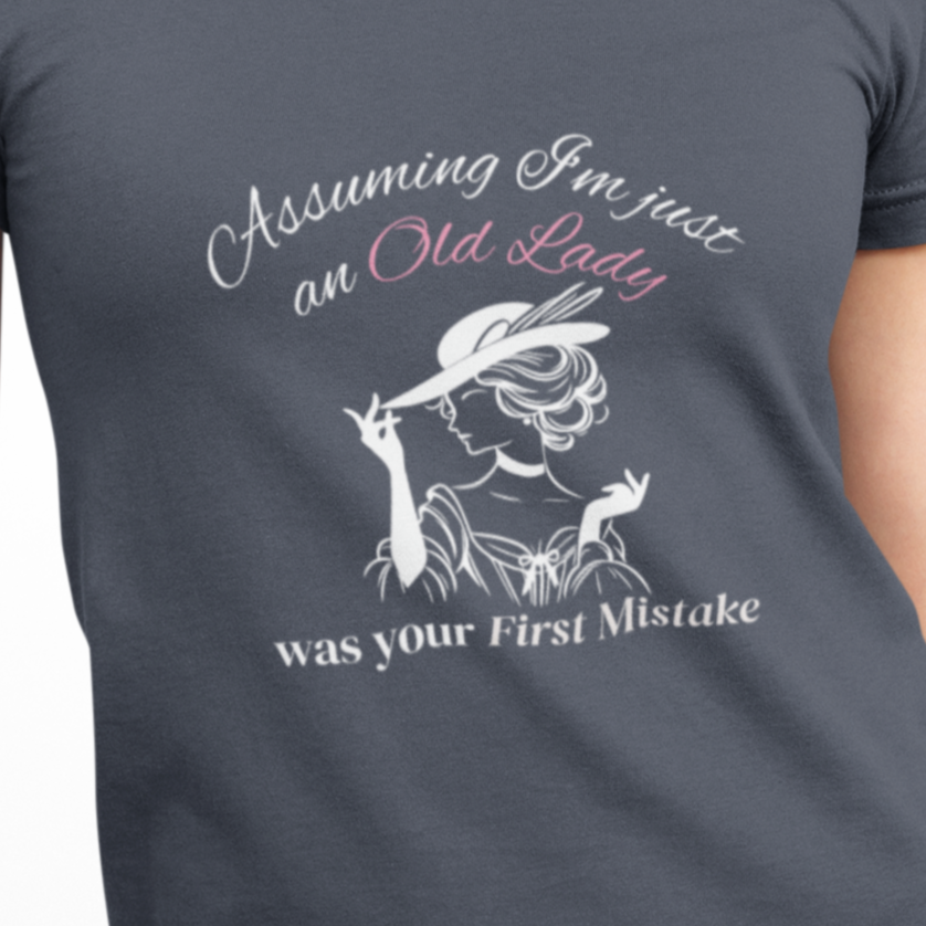 Person wearing a gray t-shirt with a graphic and text on a white background