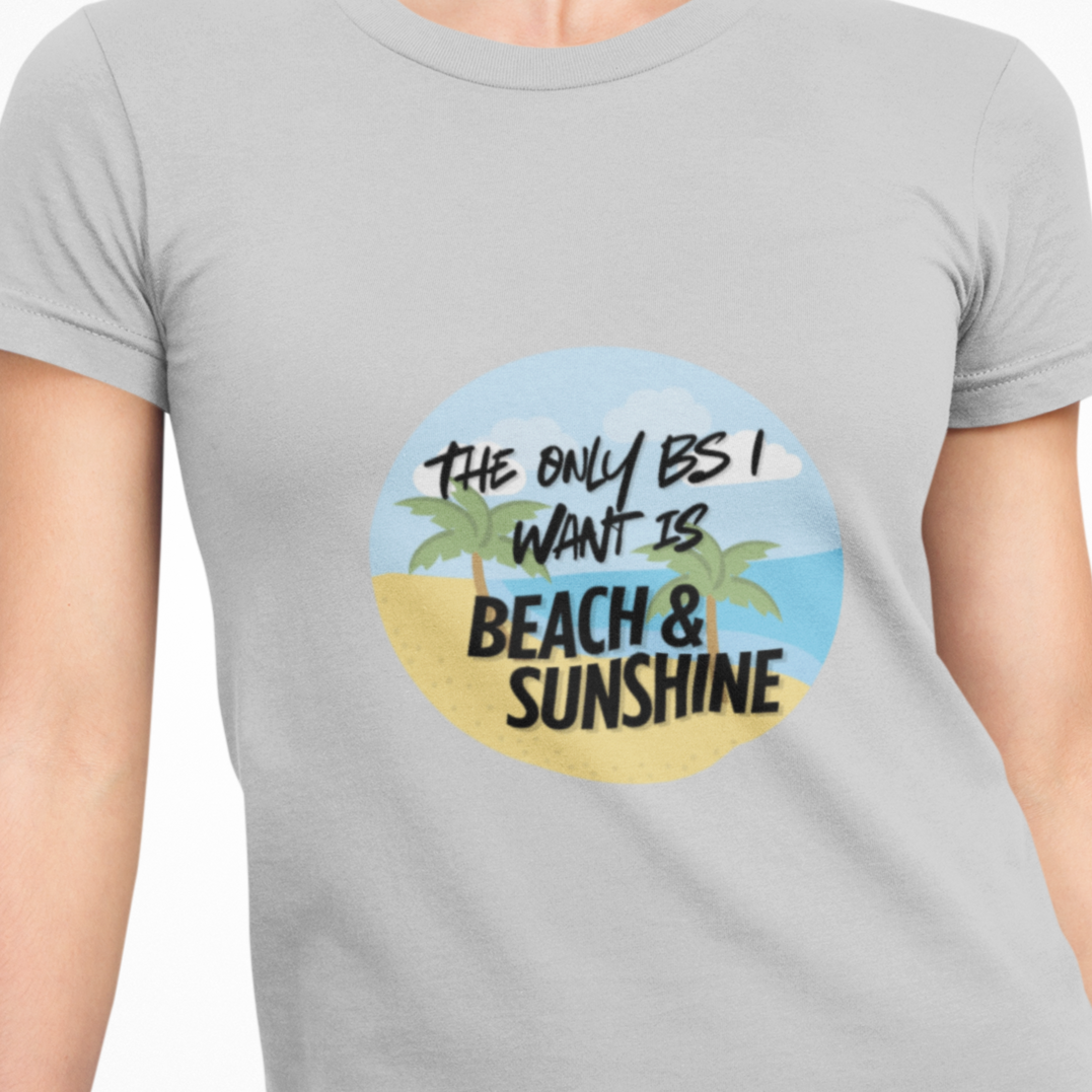 Person wearing a gray t-shirt with a beach-themed graphic and text.