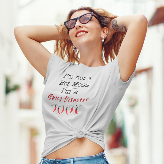 Woman wearing a tank top with text and sunglasses, standing outdoors.