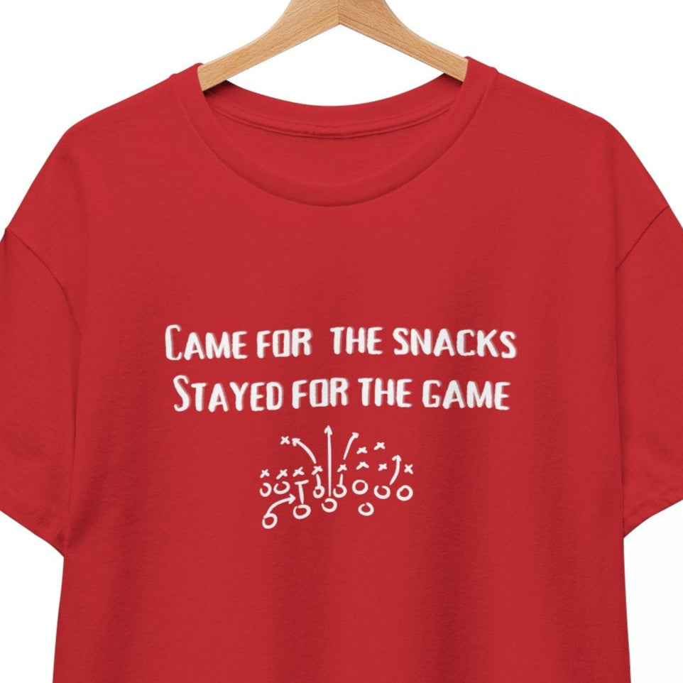 Red t-shirt with white text on a hanger against a white background